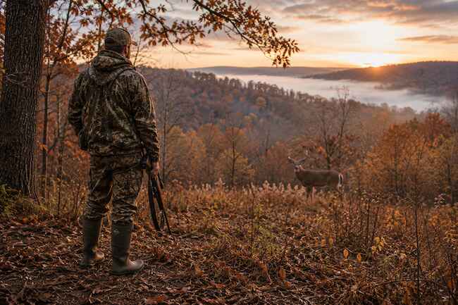 A Deer Hunter Wearing Rubber Hunting Boots A Deer Hunter Wearing Rubber Hunting Boots