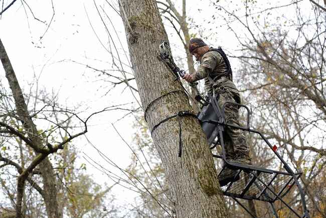 Bowhunter Wearing A Hunting Safety Harness Bowhunter Wearing A Hunting Safety Harness